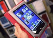 Pearson investasi teknologi Nook e-reader dan tablet