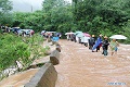 Banjir & longsor tewaskan 15 warga China