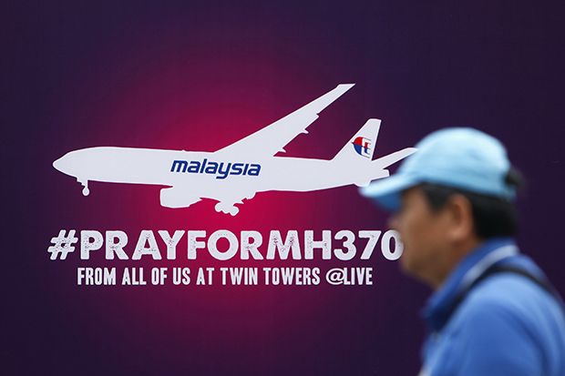 Banjir kritik soal pencarian MH370, Singapura bela Malaysia