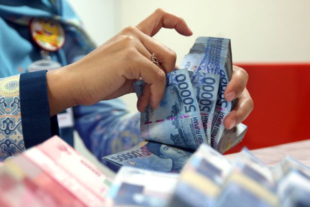 Rupiah Dibuka Terjungkal ke Rp14.100/USD
