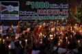Aksi 1000 Lilin Relawan Jokowi-JK
