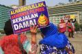 Aksi Damai Ibu-ibu Tuntut Jokowi-JK Tepati Janji Kampanye