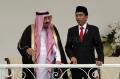 Di Bawah Guyuran Hujan, Presiden Jokowi Sambut Raja Salman di Istana Bogor
