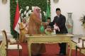 Di Bawah Guyuran Hujan, Presiden Jokowi Sambut Raja Salman di Istana Bogor