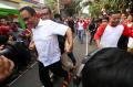 Anies Baswedan Ikut Lomba Tarik Tambang di Jalan Jaksa