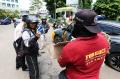 Komunitas Forkoci Jakarta Bagikan Masker Gratis ke Pengendara